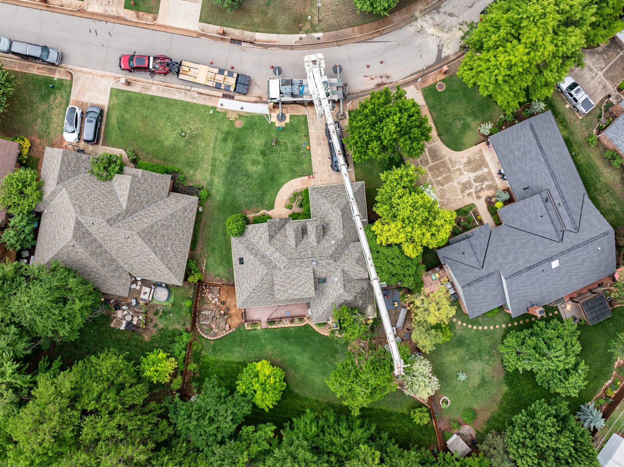 Nadir roof mapping pass over a residential crane job: every plane in one frame.