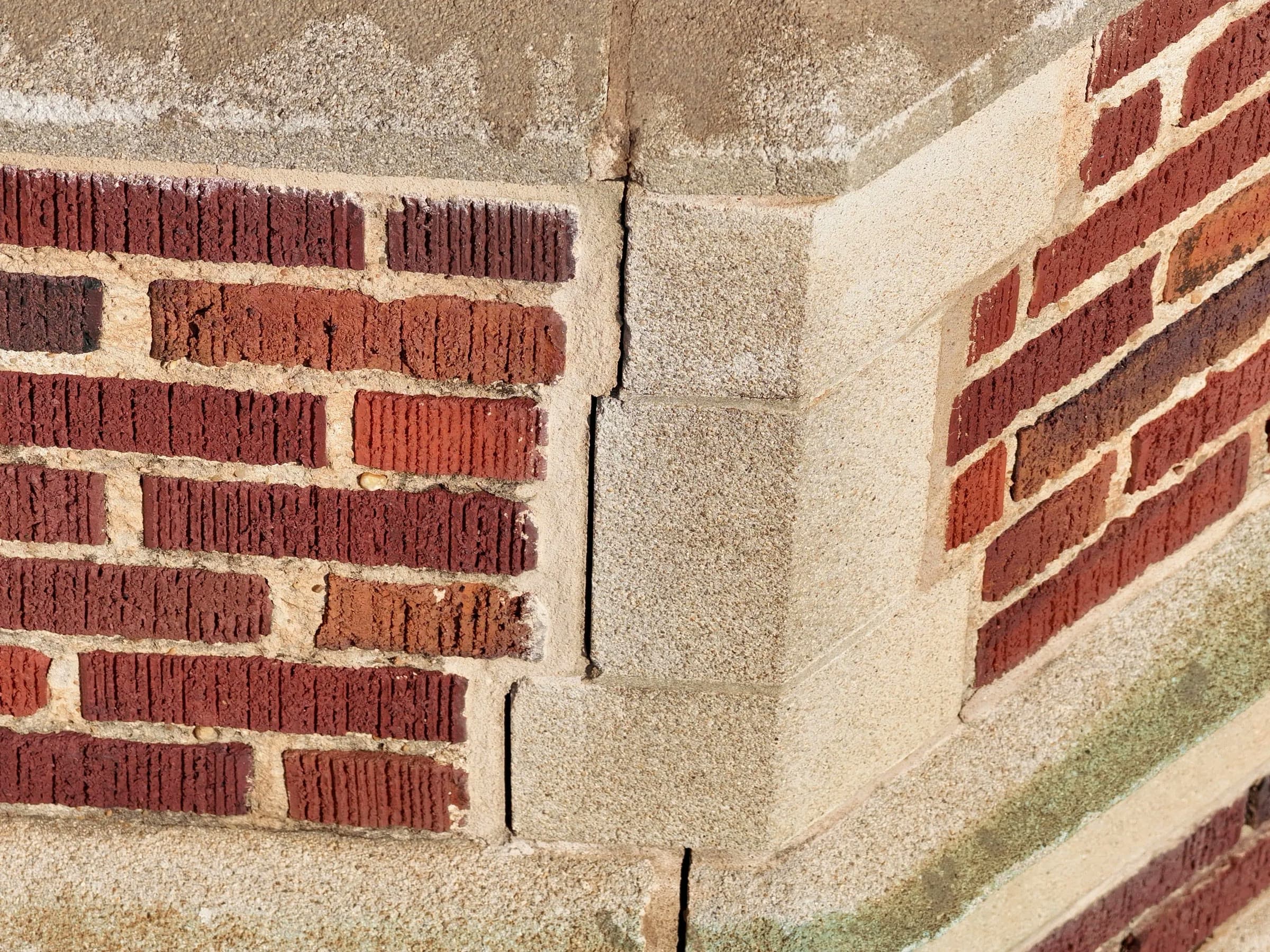 Close-range drone photograph showing cracking in a building structure