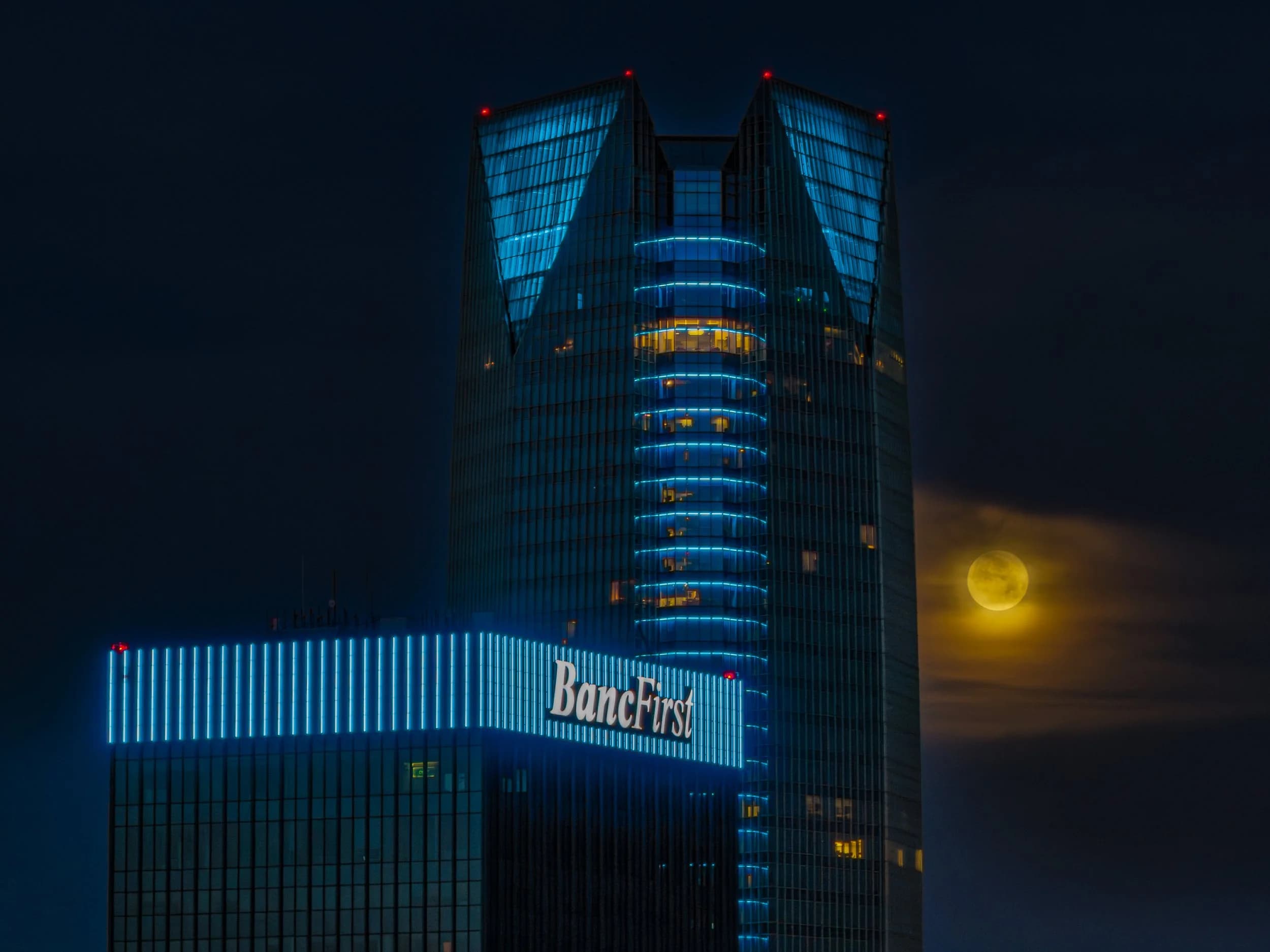First light on the BancFirst Tower, moonset in the distance.